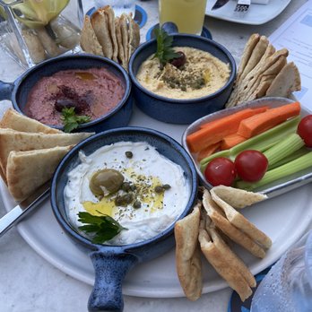 Ouzo Bay - Dip trio appetizer (date and goat cheese, hummus, tzatziki) - Greek Near Me - Baltimore, Maryland Ouzo Bay - Dip trio appetizer (date and goat cheese, hummus, tzatziki) - Greek Near Me - Baltimore, Maryland