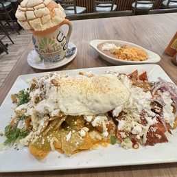 Chilaquiles Trio with The Best Cafe De Olla topped with a 1 Concha Chilaquiles Trio with The Best Cafe De Olla topped with a 1 Concha