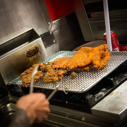 Wholly Schnit - Fresh as F@$k handmade chicken schnitzel just out of the fryer.
