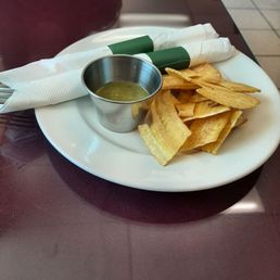 Complimentary Plantain Chips with 5-alarm dipping sauce. Complimentary Plantain Chips with 5-alarm dipping sauce.