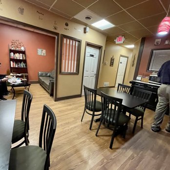 Uptown Joe - a man sitting at a table in a restaurant - Coffee & Tea Near Me - Louisville, Ohio Uptown Joe - a man sitting at a table in a restaurant - Coffee & Tea Near Me - Louisville, Ohio