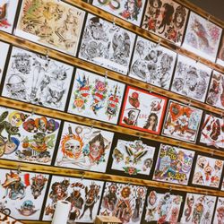 Fantasy Tattoo & Piercing Shop - Check our wall and call! Set up an appointment with us to get some nice flash from various artists, including those at the shop!