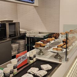 Green Beans Coffee - Counter with warm Prepackaged sandwiches, on a warming sheet