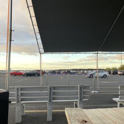 Thrifty Car Rental - Tented area to wait for your primary and secondary drivers to be serviced.