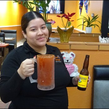 Los Zarapes Mexican Restaurant - My super friendly server, Anna, brings my "Michelada Grande" to my table with a smile.  Yes, the drink is a big one... - Mexican Near Me - Granite Bay, California