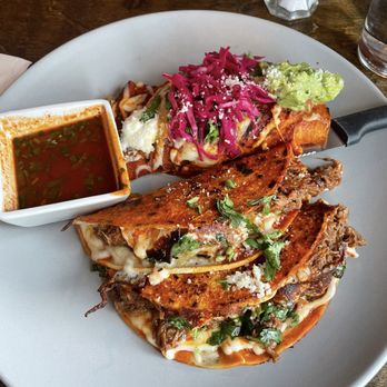 Mexcal - Two birria tacos and one carnitas enchilada - Mexican Near Me - Reno, Nevada Mexcal - Two birria tacos and one carnitas enchilada - Mexican Near Me - Reno, Nevada