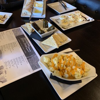 Provisions Wine Lounge - Baguette with butter, olive oil, and Fustini's balsamic vinegar.  Roasted cauliflower with aioli, grape leaves with tzatziki and pita. - Beer, Wine & Spirits Near Me - Boyne City, Michigan