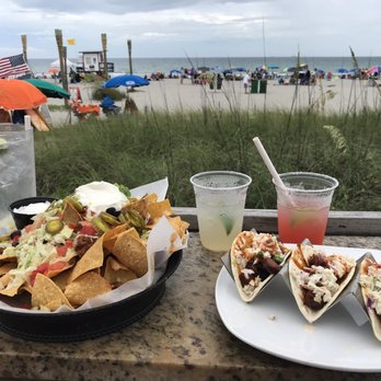 Coconuts On The Beach - Nachos with beef and tacos - Bars Near Me - Cocoa Beach, Florida Coconuts On The Beach - Nachos with beef and tacos - Bars Near Me - Cocoa Beach, Florida