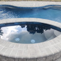Hot Rod Construction - Finished tile and Coping on a custom Pool!