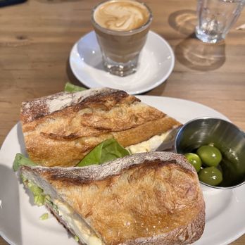 Artie's - Mortadella Sandwhich Mortadella, local brie, homemade mayonnaise, and piparra pappers Plus Cortado coffee - Pizza Near Me - Maplewood, New Jersey Artie's - Mortadella Sandwhich Mortadella, local brie, homemade mayonnaise, and piparra pappers Plus Cortado coffee - Pizza Near Me - Maplewood, New Jersey