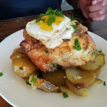 Tweets - Chicken or egg?? Notice patient hands waiting to dig into the giant herbed half chicken with potatoes, topped with an egg - Cafes Near Me - Edison, Washington