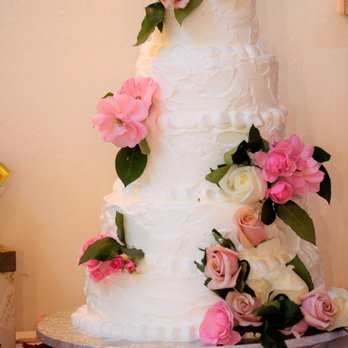 La Farfalla Bakery - Wedding cake decorated with fresh flowers. Different flavors for each tier (fruit mousses, black forest, and vanilla with fruit and cream) - Bakeries Near Me - Fremont, California