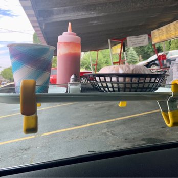Charlie's Drive-In - a tray of condiments and a basket of ketchup - American Near Me - Hortonville, Wisconsin