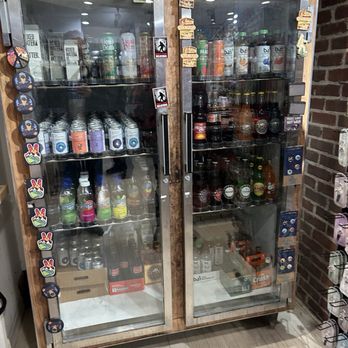 Sunbeam General Store - Refrigerators stocked with canned drinks, bottled water, and bottled beers are shown in a store setting. - Accessories Near Me - New Hope, Pennsylvania