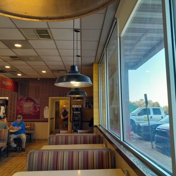 Huddle House - a man sitting at a table looking out the window - Breakfast & Brunch Near Me - Cuthbert, Georgia Huddle House - a man sitting at a table looking out the window - Breakfast & Brunch Near Me - Cuthbert, Georgia