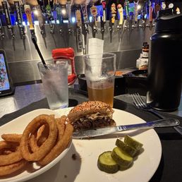 Whiskey Cheddar Burger medium with whiskey glaze and mushrooms, side of Onion Rings, Lost Coast Tangerine beer