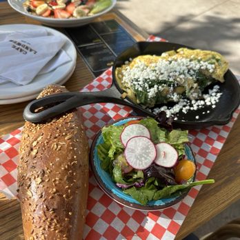 Cafe Landwer- Front - Spinach and feta omelet with greens and multigrain bread - Breakfast & Brunch Near Me - Toronto, Ontario Cafe Landwer- Front - Spinach and feta omelet with greens and multigrain bread - Breakfast & Brunch Near Me - Toronto, Ontario