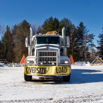 Structural Wood - a large truck with a dog on the front - Building Supplies Near Me - Waddington, New York Structural Wood - a large truck with a dog on the front - Building Supplies Near Me - Waddington, New York