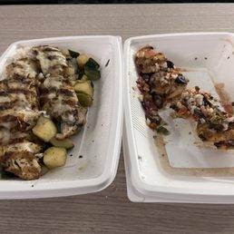 2 rockfish fillets over white rice and zucchini with a side of shrimp.