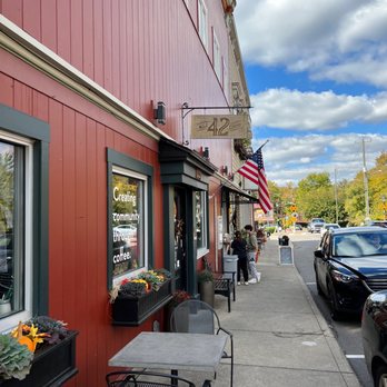 Mile 42 Coffee - a sidewalk with tables and chairs - Coffee & Tea Near Me - Loveland, Ohio Mile 42 Coffee - a sidewalk with tables and chairs - Coffee & Tea Near Me - Loveland, Ohio