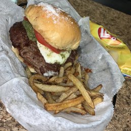 The UB (Utica Burger), pesto and mozzarella. Hand cut fries sprinkled with turmeric and lemon The UB (Utica Burger), pesto and mozzarella. Hand cut fries sprinkled with turmeric and lemon