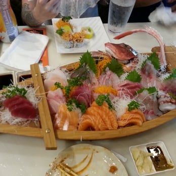 Ushio Sushi - Chef's special sashimi boat for 3. This boat was delicious with 5 different types of Japanese fly fish. - Sushi Bars Near Me - Davie, Florida Ushio Sushi - Chef's special sashimi boat for 3. This boat was delicious with 5 different types of Japanese fly fish. - Sushi Bars Near Me - Davie, Florida