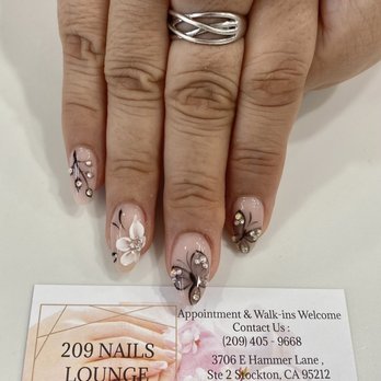 209 Nails Lounge - QQ Thanks for the #blackandwhite art with nude pink acrylics! The #jewels sparkle like real #diamonds!!! #almond round shape is perfect! - Nail Salons Near Me - Stockton, California