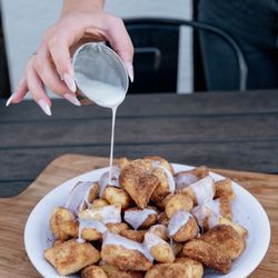Tony Pepperoni Pizzeria - Cinnapops - mini dough balls tossed in cinnamon sugar with frosting for dipping