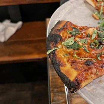 Zeeks Pizza - a slice taken out of a pizza - Pizza Near Me - Bellingham, Washington Zeeks Pizza - a slice taken out of a pizza - Pizza Near Me - Bellingham, Washington