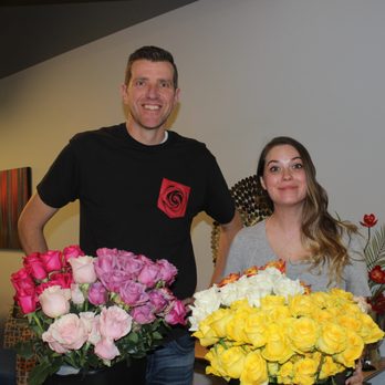 Boostability - Our CFO Russ handing out flowers on Valentine's Day - Marketing Near Me - Lehi, Utah Boostability - Our CFO Russ handing out flowers on Valentine's Day - Marketing Near Me - Lehi, Utah