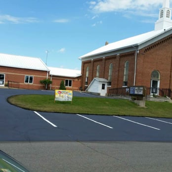 Upston Asphalt Maintenance - a church with a steeple - General Contractors Near Me - Leonidas, Michigan Upston Asphalt Maintenance - a church with a steeple - General Contractors Near Me - Leonidas, Michigan
