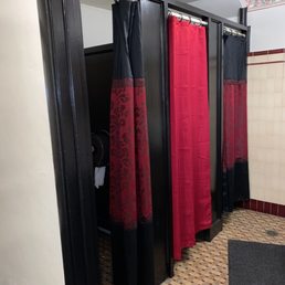 Bathroom stalls have shower curtains instead of doors... Bathroom stalls have shower curtains instead of doors...