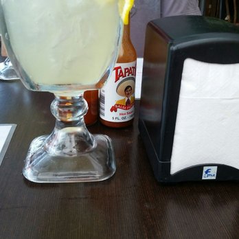 Iguana Banana - One huge margarita. See napkin dispenser for scale. A bit too sweet so we added more lemon and lime to make it right. - Mexican Near Me - Puerto Peñasco, SON Iguana Banana - One huge margarita. See napkin dispenser for scale. A bit too sweet so we added more lemon and lime to make it right. - Mexican Near Me - Puerto Peñasco, SON