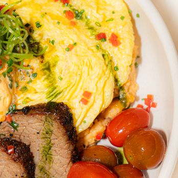 Yolked Kitchen - Tri Tip & Eggs
Certified Angus Beef Tri Tip, Farm Fresh Eggs, Red Chile Cheddar Grits, Steak Butter - Breakfast & Brunch Near Me - Clovis, California