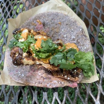 Nixta Taqueria - The roasted Japanese cauliflower, nestled in a ground heritage corn tortilla - Mexican Near Me - Austin, Texas