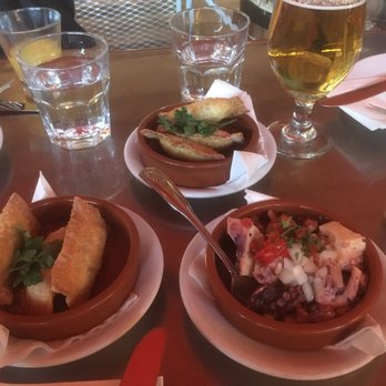 Costa Brava - marinated octopus in front, tuna pastry in back - Tapas Bars Near Me - San Diego, California Costa Brava - marinated octopus in front, tuna pastry in back - Tapas Bars Near Me - San Diego, California