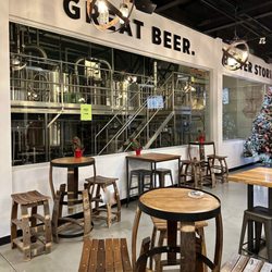 Nickel Brook Brewing - Nickel Brook Taproom - interior with barrel tables & seats