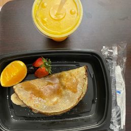 Banana Nutella crepe and fresh squeezed orange juice. Banana Nutella crepe and fresh squeezed orange juice.