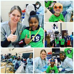 Grandview Center For Dentistry - Volunteering at the Team Smiles event sponsored by the MN Vikings, providing free dental care for the kids of Lucy Laney Elementary