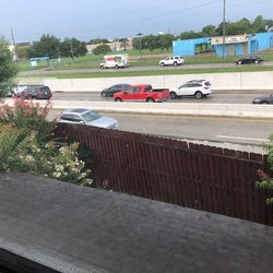 See how there is not a sound or privacy wall and the wind from the trucks has pushed the fence towards the house. ruining the fence.Terrible