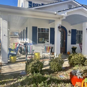 MOXI Junction - the front of a house with a porch and lawn - Coffee & Tea Near Me - Maize, Kansas