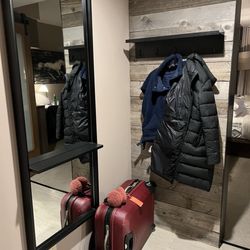 Entrance to room. The coat rack is actually a big plus and it's nice to have a place to store your luggage out of the way.