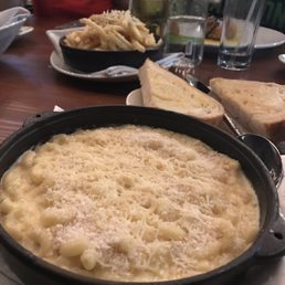 Mac and cheese - DELICIOUS and comes with toasted bread. Truffle fries in the background. Mac and cheese - DELICIOUS and comes with toasted bread. Truffle fries in the background.