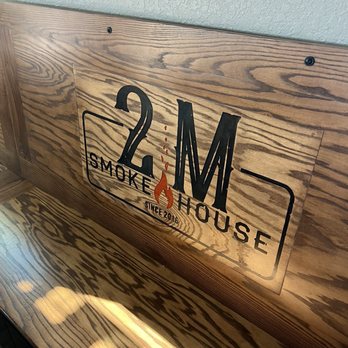 2M Smokehouse BBQ - Wooden bench in dining room - Barbeque Near Me - San Antonio, Texas