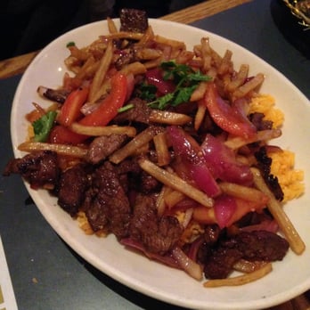 Flor de Mayo - Lomo Saltado - sliced steak sauteed with potatoes, tomato, & onion over rice - Chinese Near Me - New York, New York