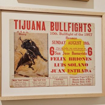 Bombera - A framed vintage poster for a bullfighting event in Tijuana, featuring a bull illustration and event details from 1957. - Mexican Near Me - Oakland, California