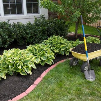 SRI Landscape Design - a wheelbarrow in a garden - Masonry/Concrete Near Me - West Babylon, New York