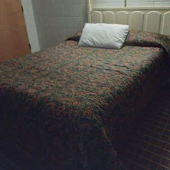 Holiday Lodge-Hawthorne - Comfortable bed (one of two with night table). Table and chairs available. - Hotels Near Me - Hawthorne, Nevada Holiday Lodge-Hawthorne - Comfortable bed (one of two with night table). Table and chairs available. - Hotels Near Me - Hawthorne, Nevada