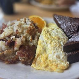 Jose Omelet- has beef, beans and rice, white cheddar cheese, and a side of sour cream Jose Omelet- has beef, beans and rice, white cheddar cheese, and a side of sour cream
