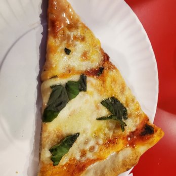 Piccolo Trattoria - a slice of pizza on a paper plate - Pizza Near Me - New York, New York Piccolo Trattoria - a slice of pizza on a paper plate - Pizza Near Me - New York, New York